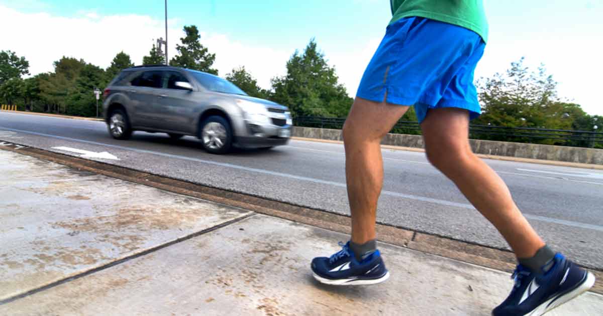 Runner next to roadway 